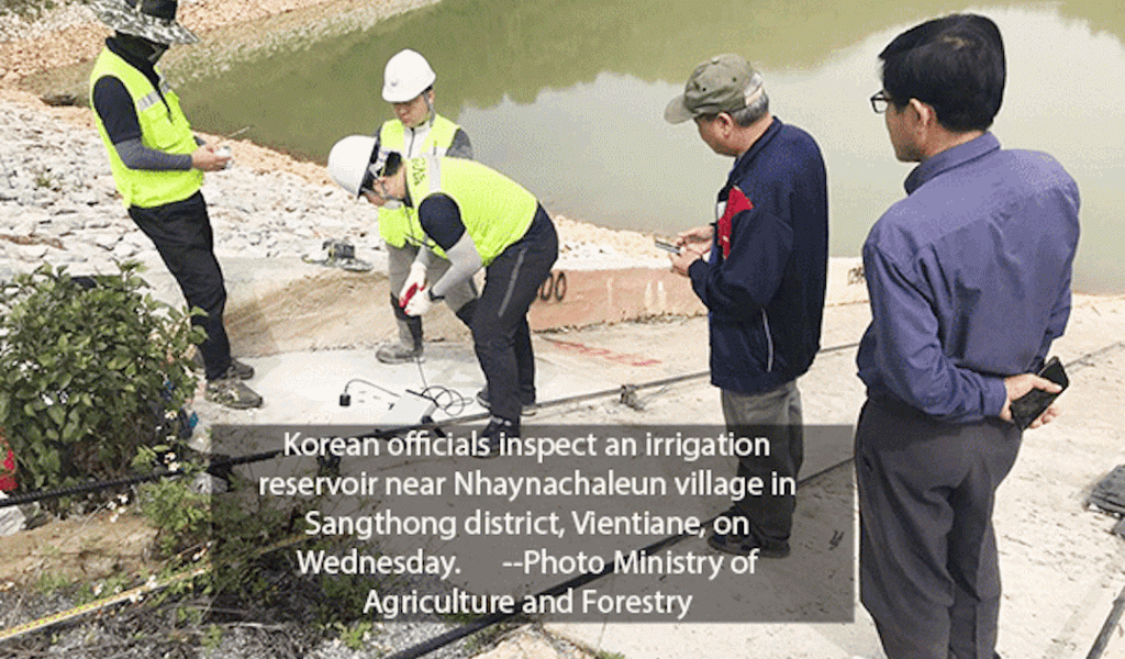 Korean officials inspect an irrigation reservoir